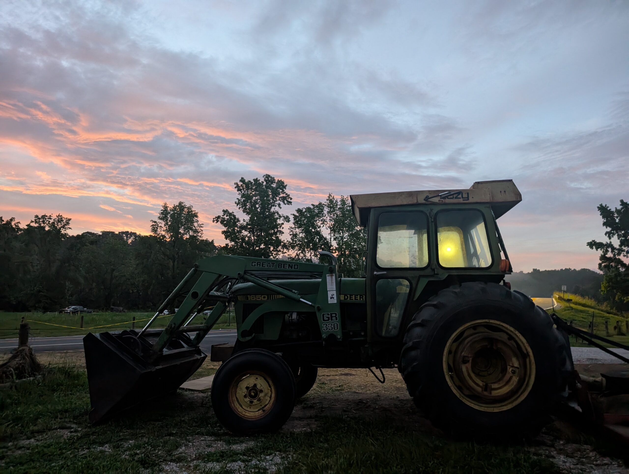 John Deere tractor at dawn at Faith Family Farms