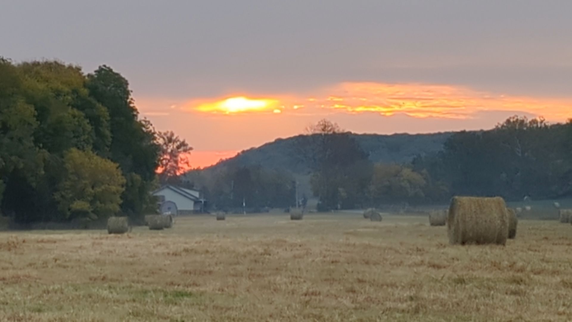 Hay bales at sunset at Faith Family Farms
