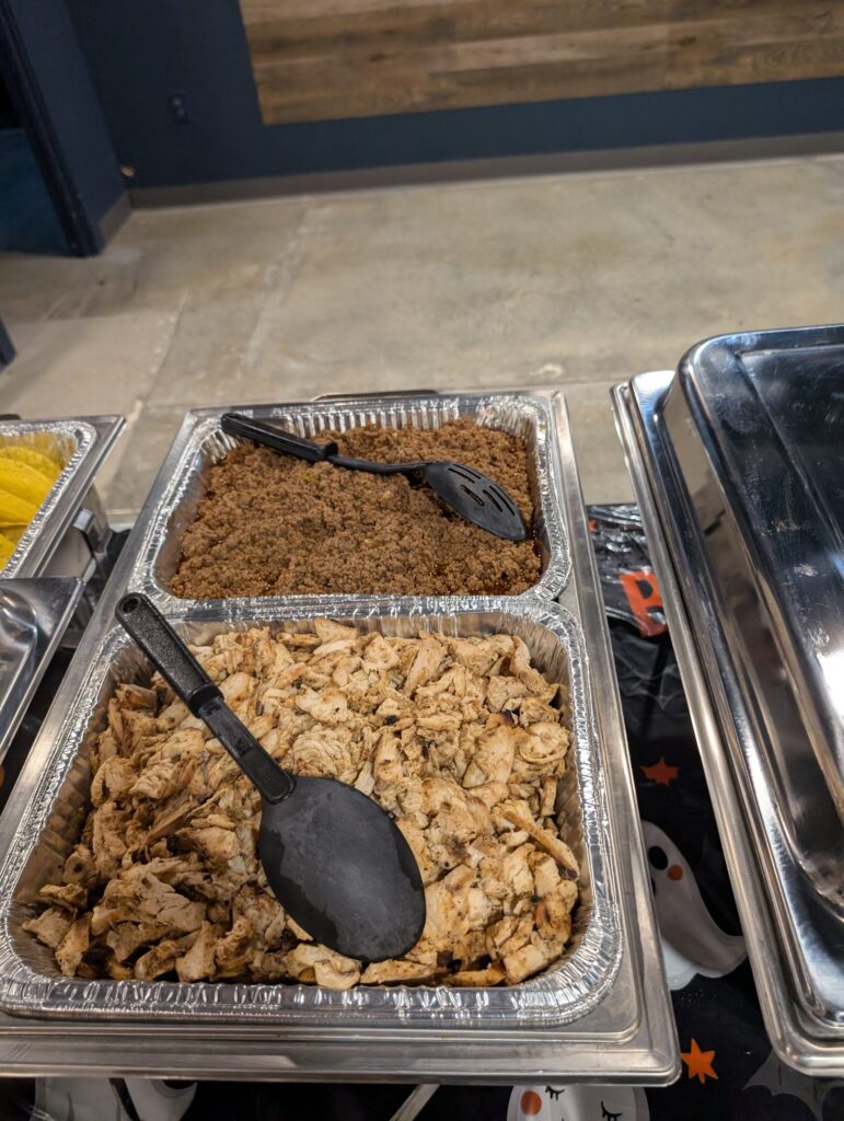Seasoned ground beef and grilled chicken for a taco bar