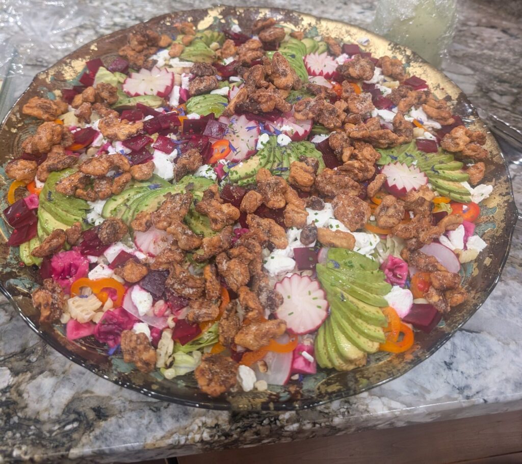 Salad with beets, avocado, radishes, and candied walnuts